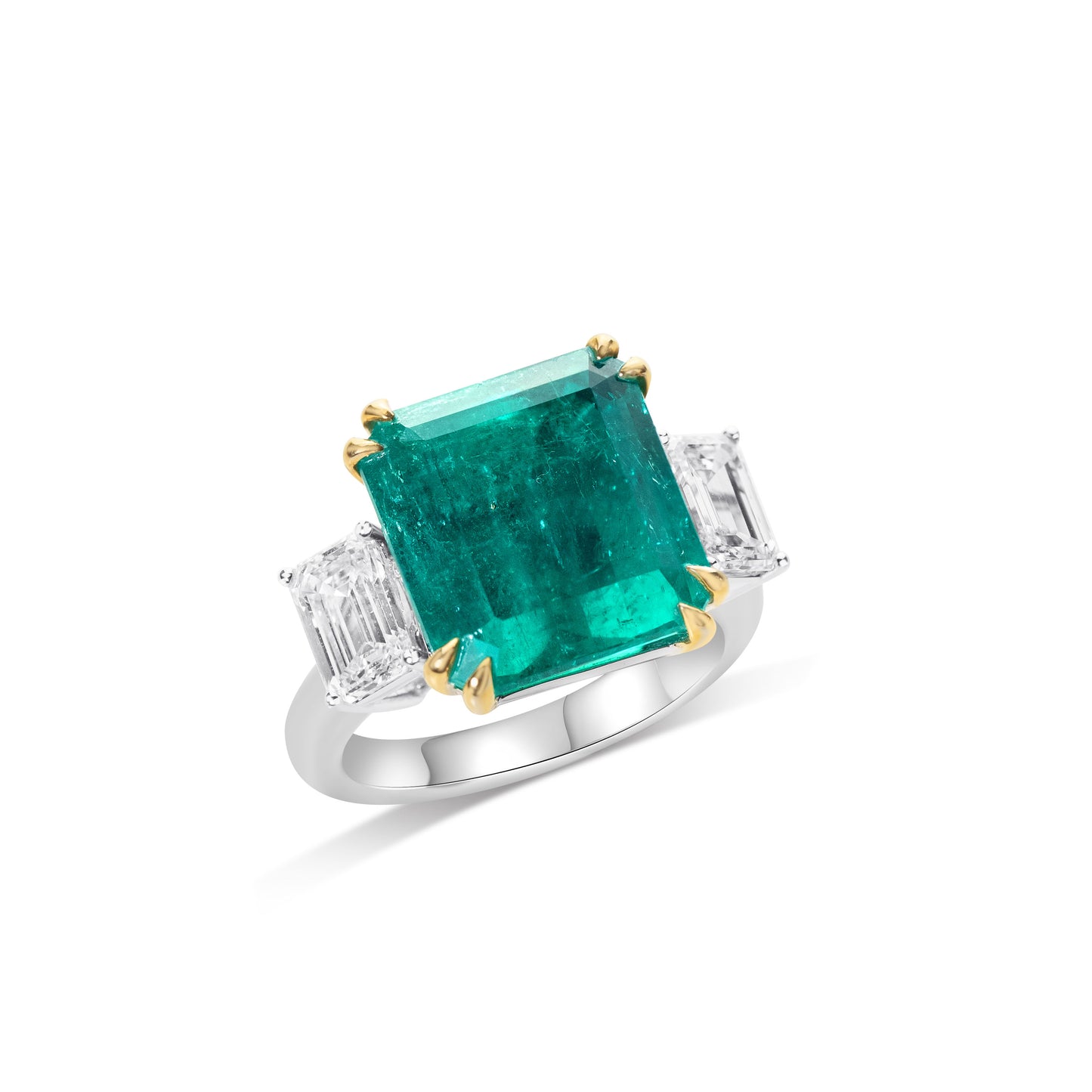 Three stone Colombian emerald ring with natural diamonds by Fantasilvia Fine Jewelry.

