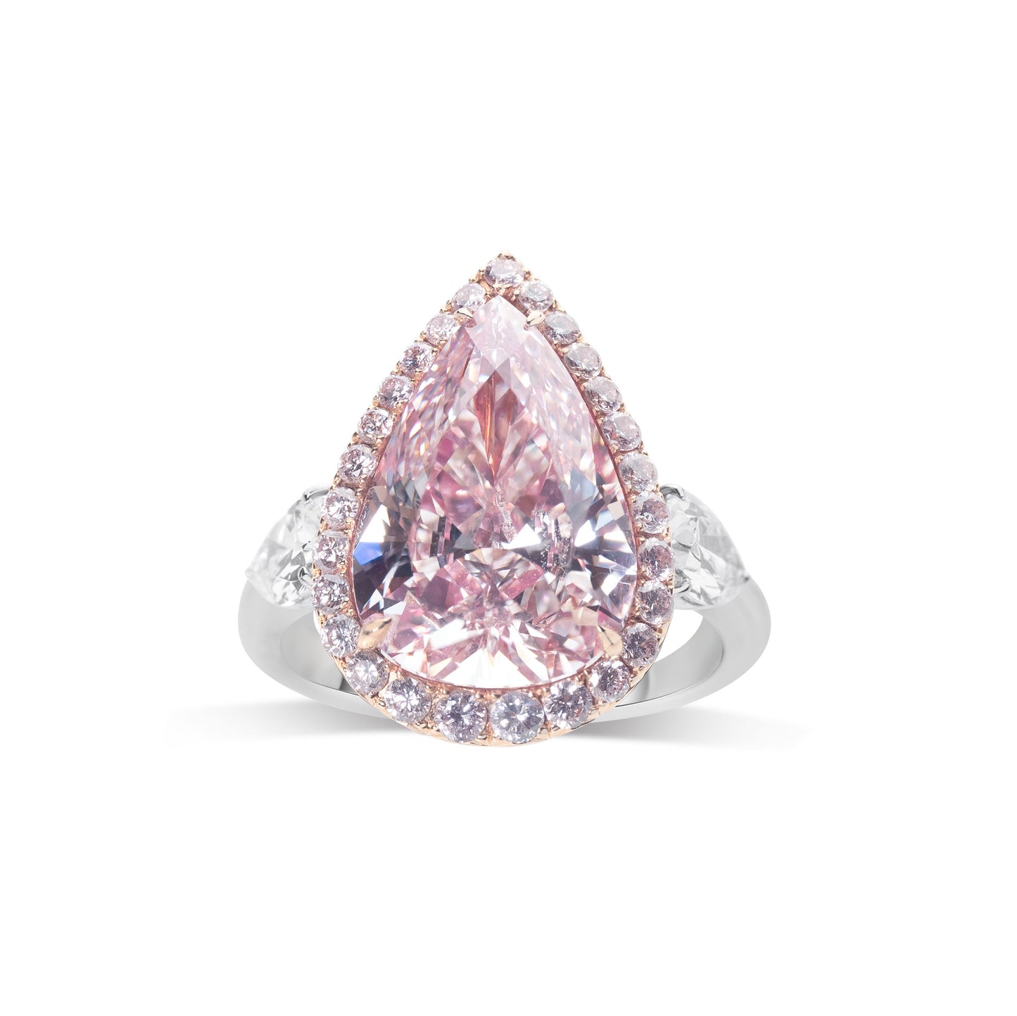 Natural pink diamond ring with halo setting by Fantasilvia Fine Jewelry.
