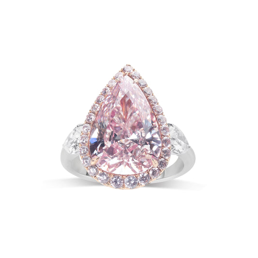 Natural pink diamond ring with halo setting by Fantasilvia Fine Jewelry.
