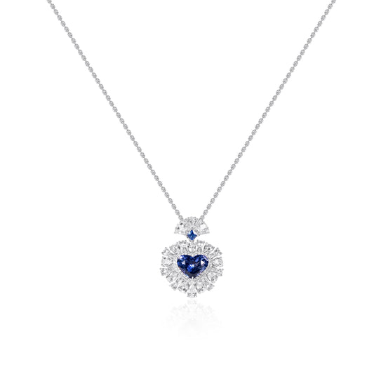 Heart-shaped natural sapphire pendant crafted in 18K gold by Fantasilvia Fine Jewelry.
