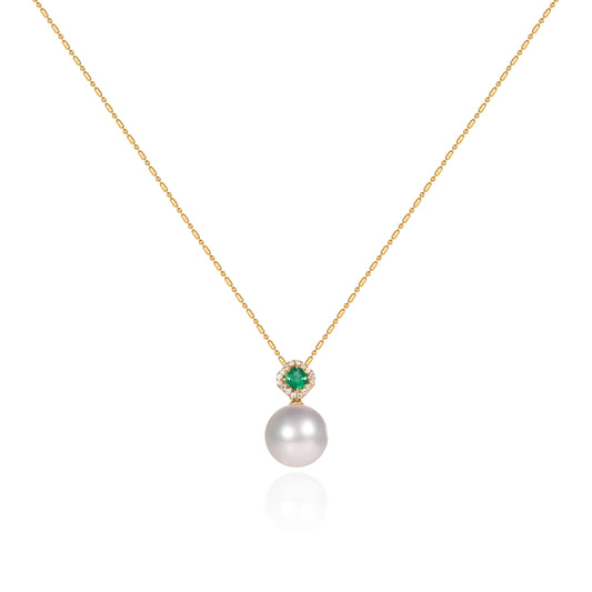 Pearl and emerald halo drop pendant with 12mm South Sea white pearl in 18K gold by Fantasilvia Fine Jewelry.
