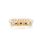 Double-strand natural white pearl bracelet with 18K yellow gold stations featuring three pear-cut red rubies and pavé diamond accents.