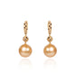 Black diamond and South Sea golden pearl dangle earrings crafted in gold by Fantasilvia Fine Jewelry.
