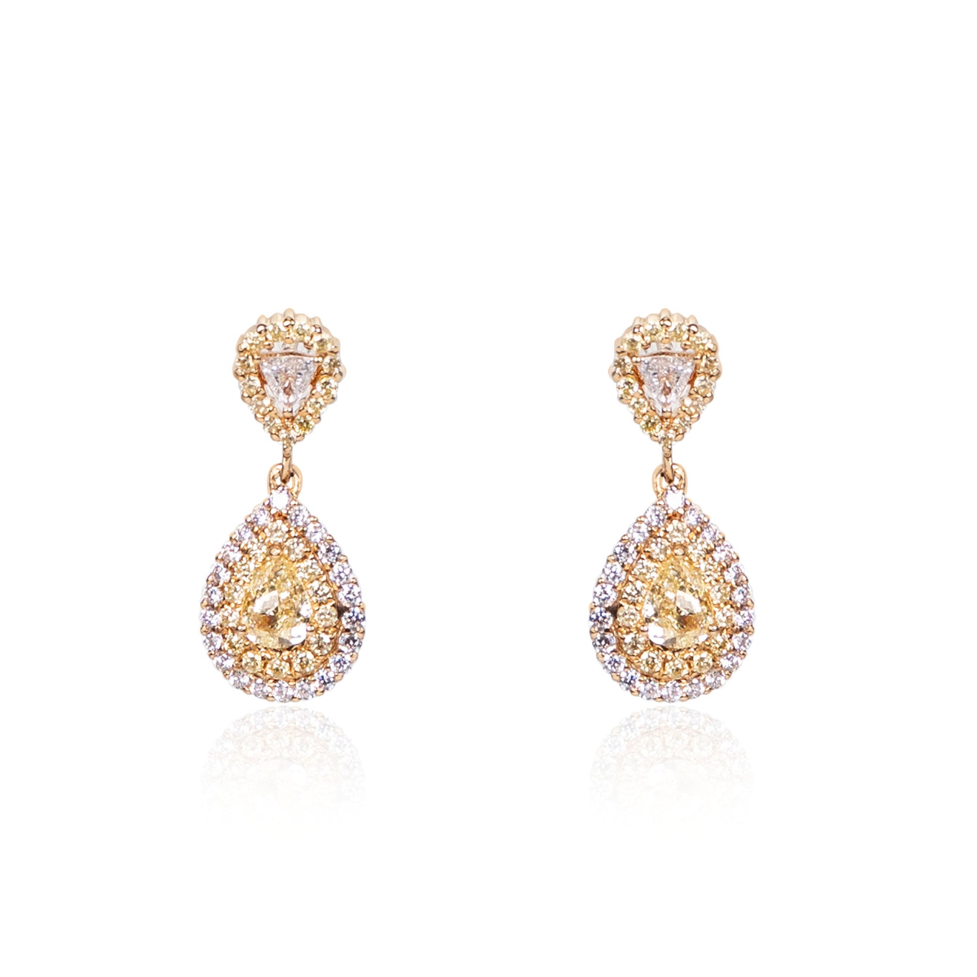 Natural fancy yellow diamond teardrop earrings in fine gold by Fantasilvia Fine Jewelry.
