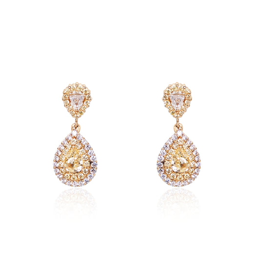 Natural fancy yellow diamond teardrop earrings in fine gold by Fantasilvia Fine Jewelry.
