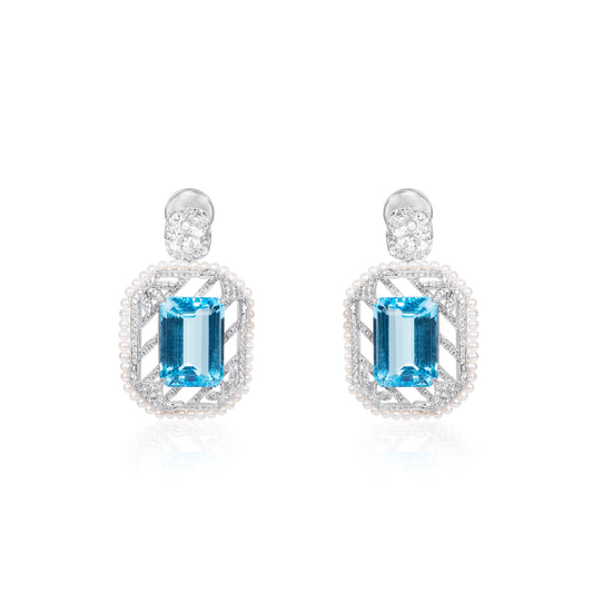 Natural blue topaz and diamond drop earrings in fine gold by Fantasilvia Fine Jewelry.
