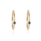 Natural emerald hoop earrings crafted in gold by Fantasilvia Fine Jewelry.
