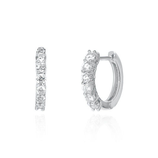 Platinum natural diamond huggie earrings featuring 0.35ct brilliant-cut diamonds, crafted by Fantasilvia Fine Jewelry.
