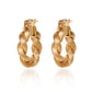 18K gold Assisi twist huggie earrings crafted by Fantasilvia Fine Jewelry.

