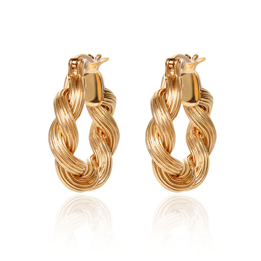 18K gold Assisi twist huggie earrings crafted by Fantasilvia Fine Jewelry.
