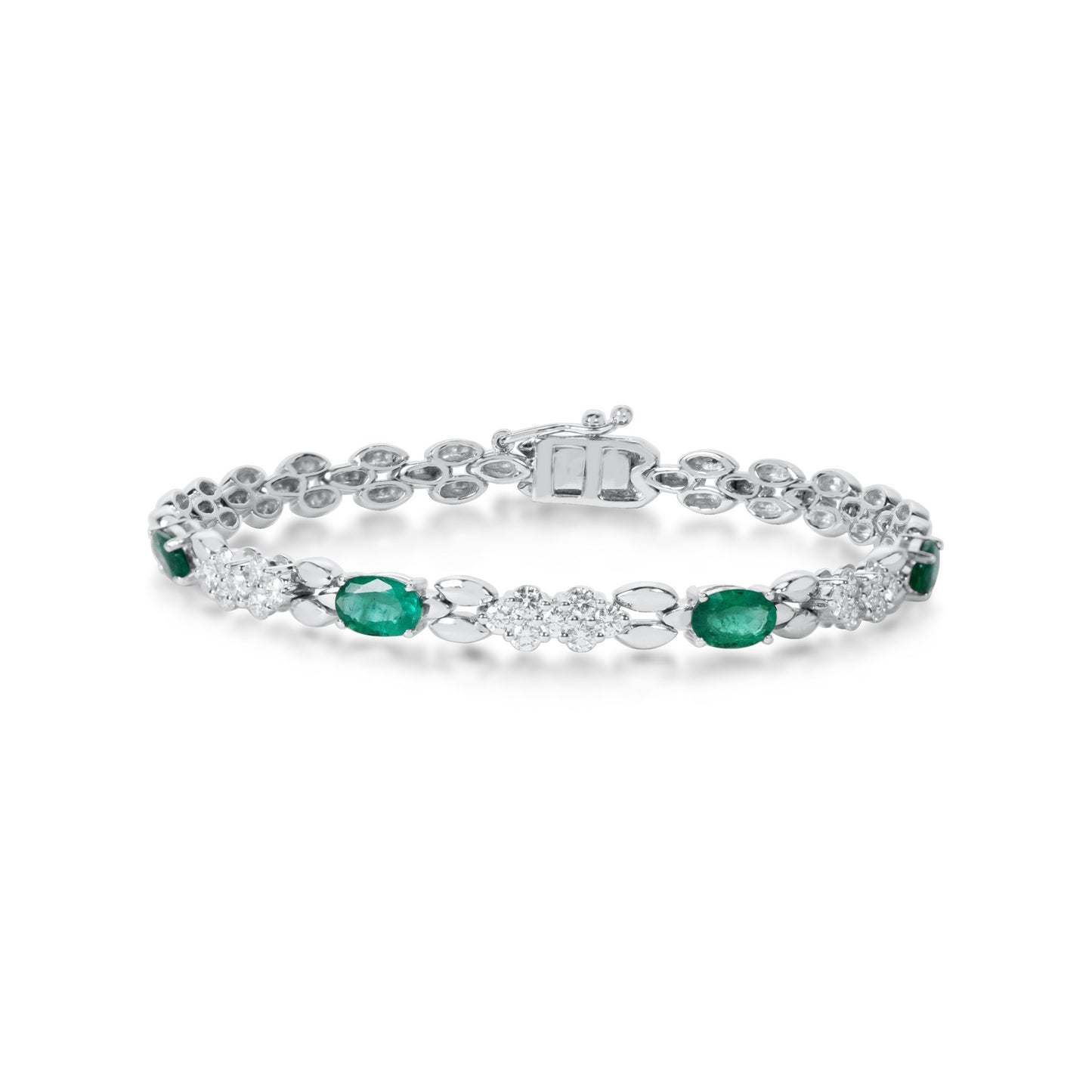 Natural diamond and emerald bracelet crafted in 18K gold by Fantasilvia Fine Jewelry.
