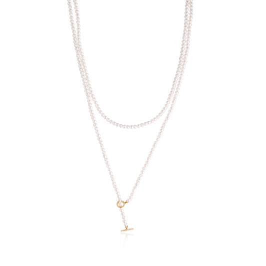 Elegant three-layer freshwater pearl necklace featuring 3mm–3.5mm lustrous pearls and a modern gold toggle clasp, crafted by Fantasilvia Fine Jewelry.
