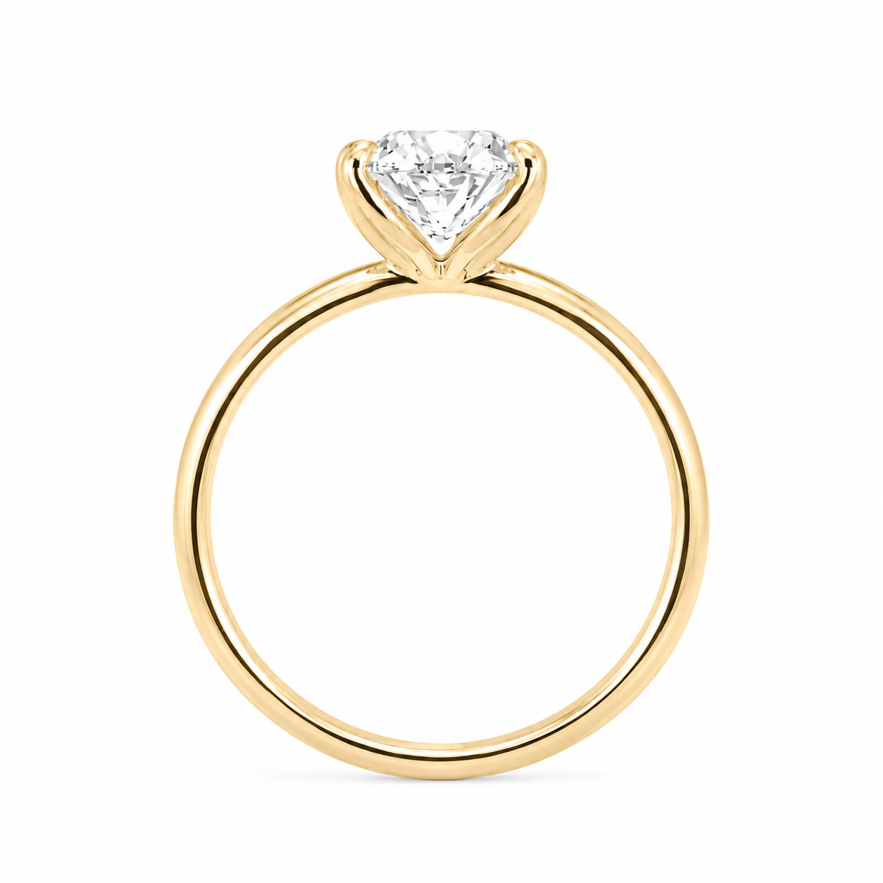 Straight profile view of a solitaire engagement ring crafted in 18K yellow gold featuring a delicate 4-prong tulip design and a 2 carat oval diamond.