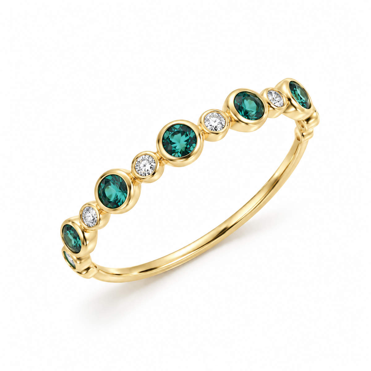 Angled view of a 14K yellow gold stackable ring, showcasing the smooth bezel settings of eight 2mm green tourmalines and seven 1.3mm lab diamonds.