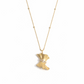 A gold pendant necklace shaped like a flowing gown with a textured finish, featuring a cinched waist accented by a row of small, round-cut diamonds, suspended from a gold station chain on a white background.