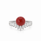 Front view of an 18K white gold statement ring showcasing a vibrant AKA red coral center stone accented with a contoured marquise diamond setting.