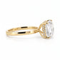 Side profile of a 14K yellow gold engagement ring highlighting the four-prong setting, the hidden halo with pavé diamonds, and the depth of the 3.08-carat cushion modified brilliant diamond.