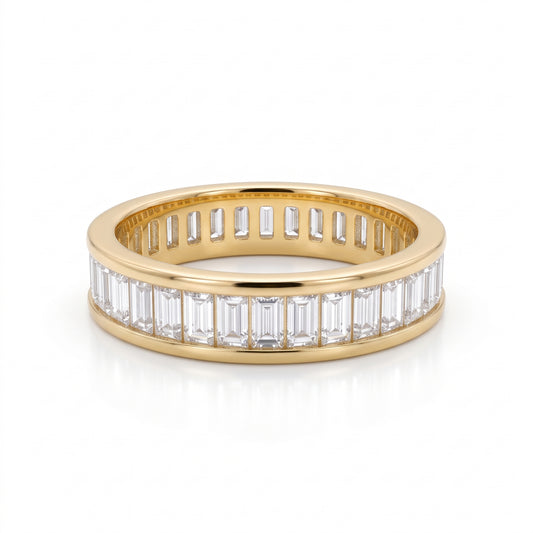 Front view of an 18K solid yellow gold eternity band featuring channel-set baguette lab-grown diamonds
