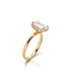 Side profile of an 18K yellow gold engagement ring showing a 3.28-carat emerald cut diamond with a diamond-encrusted hidden halo setting.