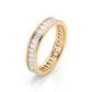 Angled view of an 18K yellow gold linea baguette diamond band, showing the continuous channel setting of lab-grown diamonds.