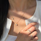 Model wearing the 18K Shimmering Steps Diamond Ring alongside the Duo-Flora Petite Necklace and Floral Ring.