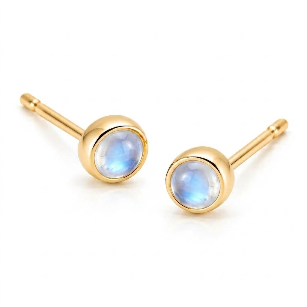 Pair of 18K yellow gold stud earrings featuring bezel-set round iridescent moonstone cabochons.