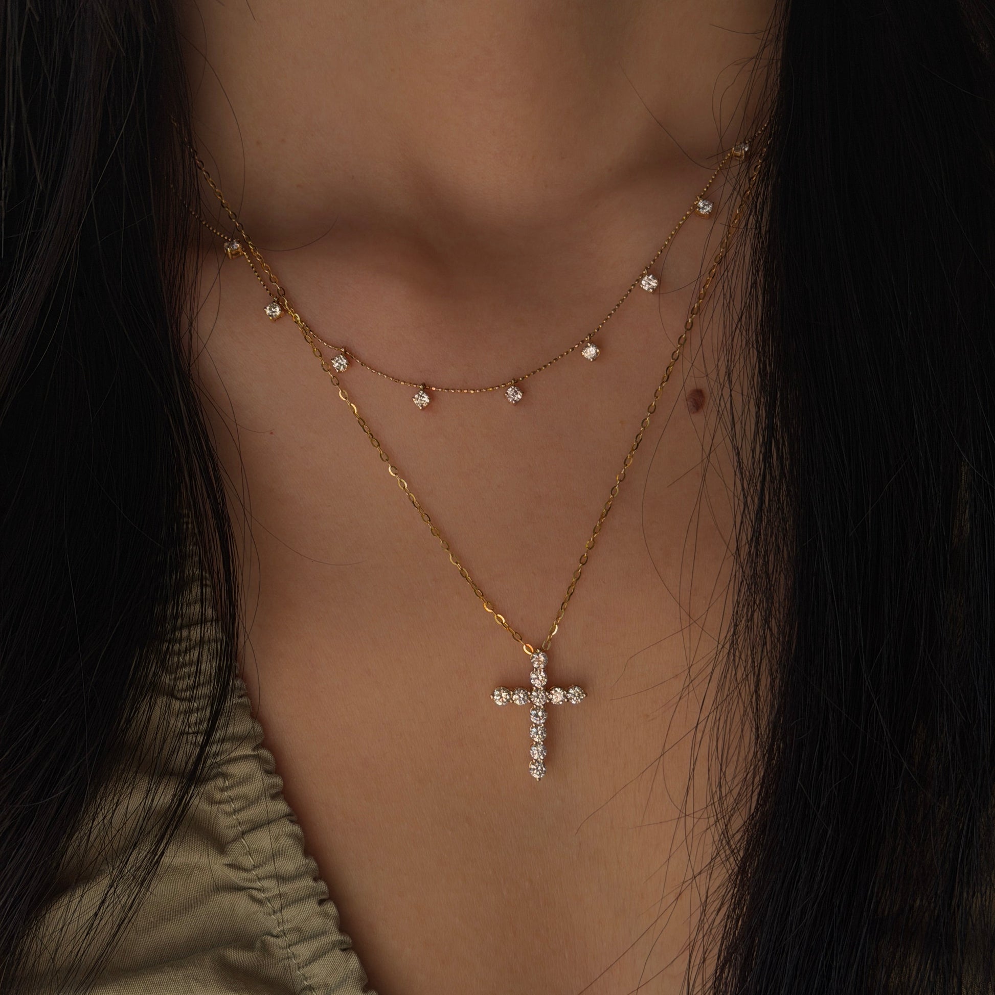 18K gold natural diamond cross pendant featuring round brilliant-cut diamonds, styled with a delicate 18K gold natural diamond station chain.