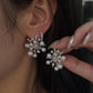 18K gold natural diamond and Akoya pearl statement earrings featuring luminous Akoya pearls accented with sparkling natural diamonds in a sculptural starburst design.