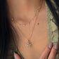 18K gold natural diamond star pendant featuring a two-tone open star design, styled with a versatile 18K gold natural diamond station chain.