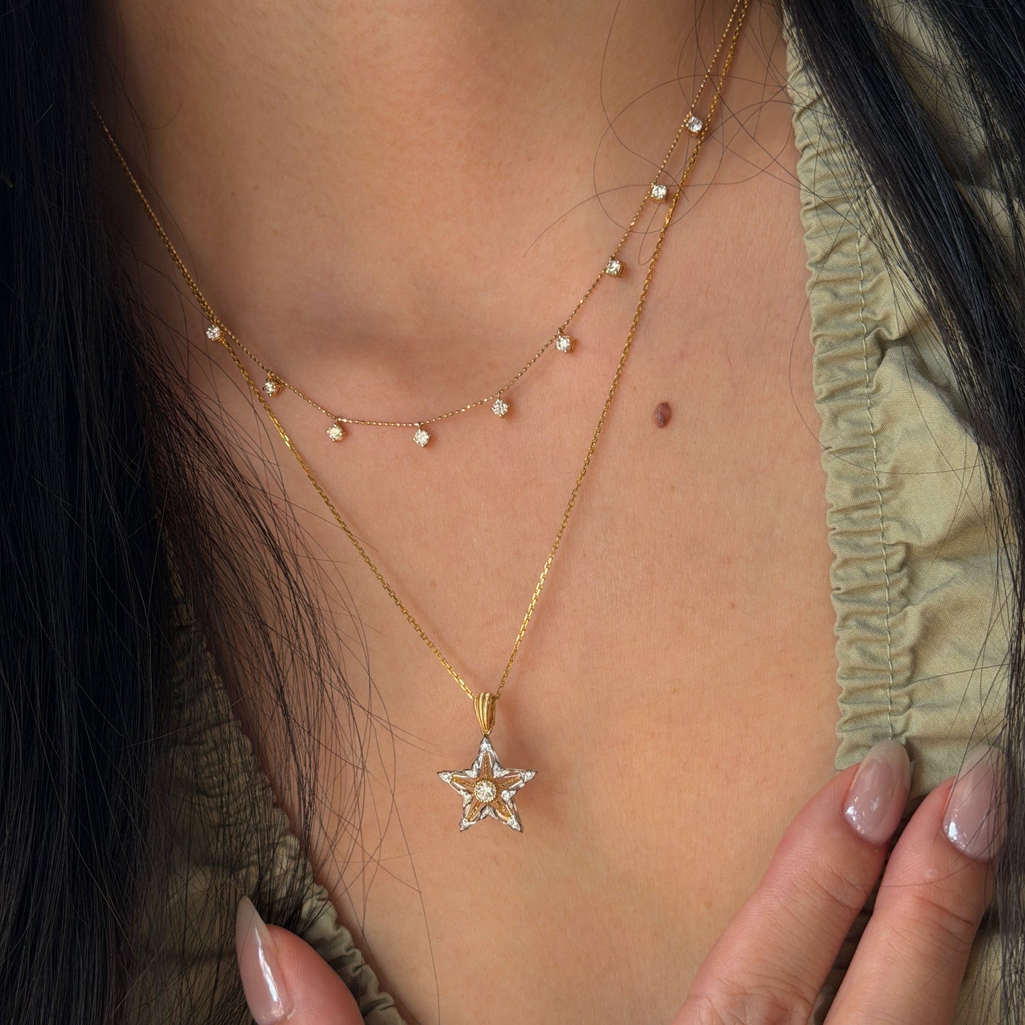 18K gold natural diamond star pendant featuring a two-tone open star design, styled with a versatile 18K gold natural diamond station chain.